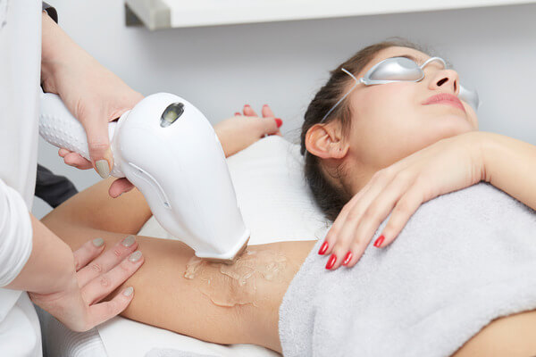 Laser hair removal treatment reducing razor bumps on skin